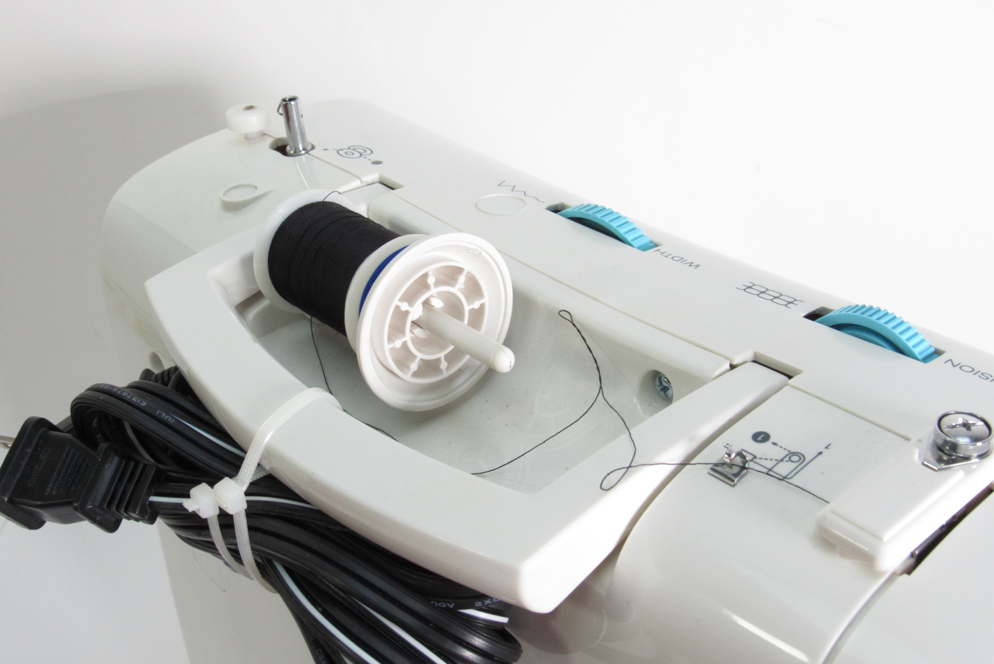 Thread and Buttons from Singer Simple™ Sewing Machine Model 2263
