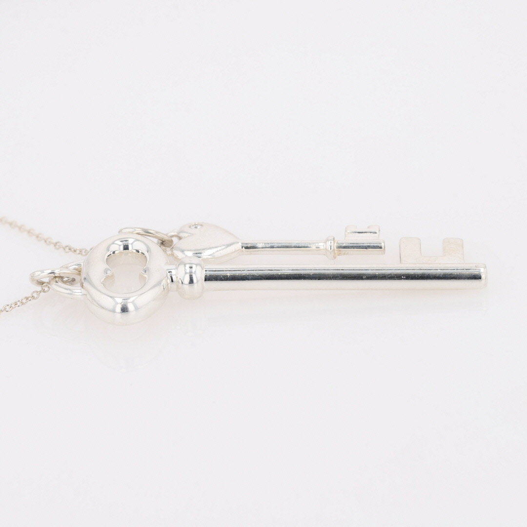 Tiffany & Co. .01ct Diamond Double Key Pendant on 18